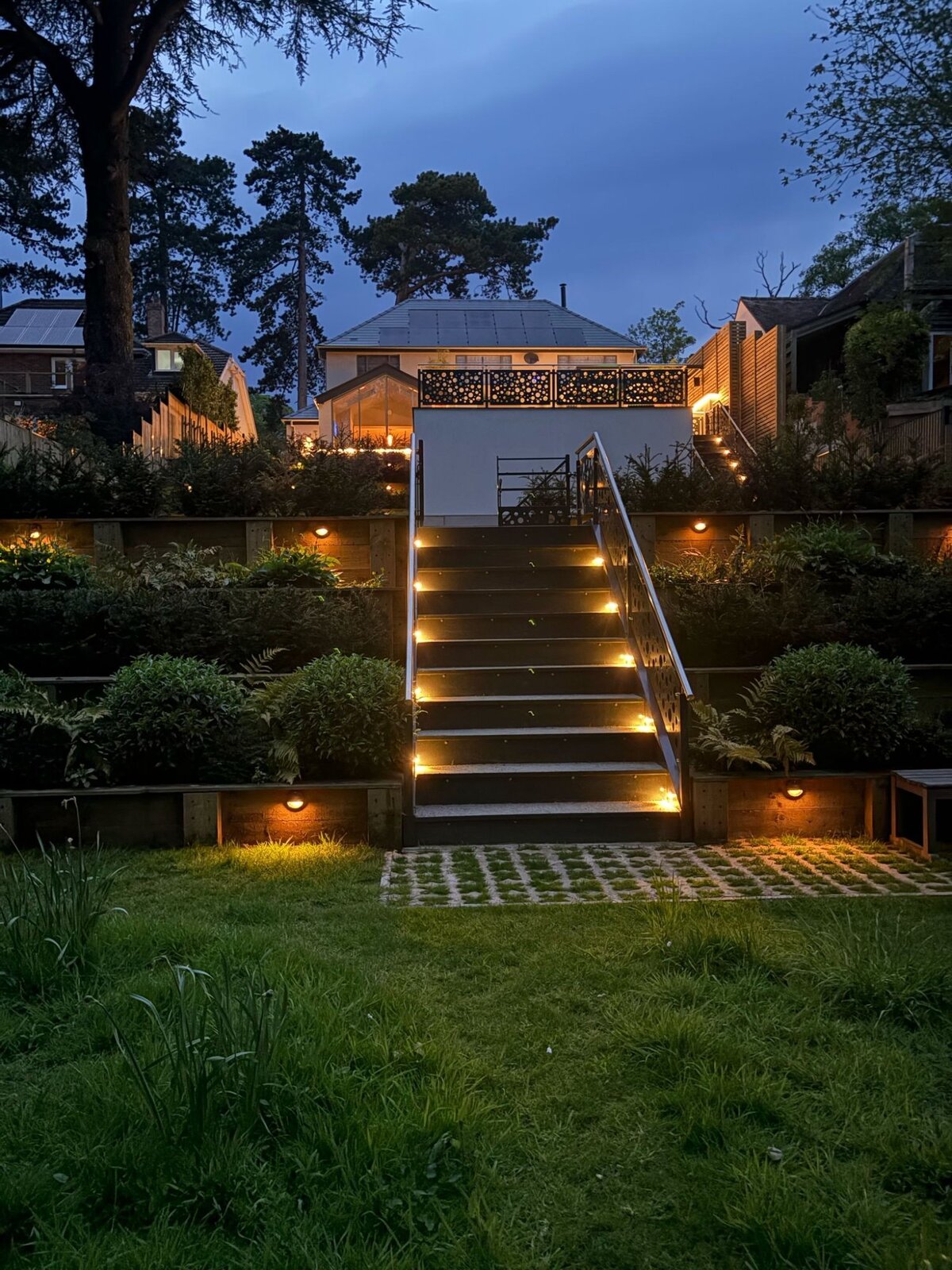 Garden lighting lit steps and terracing at night