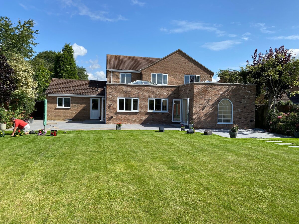 Finished rear extension with landscaped patio in sunshine