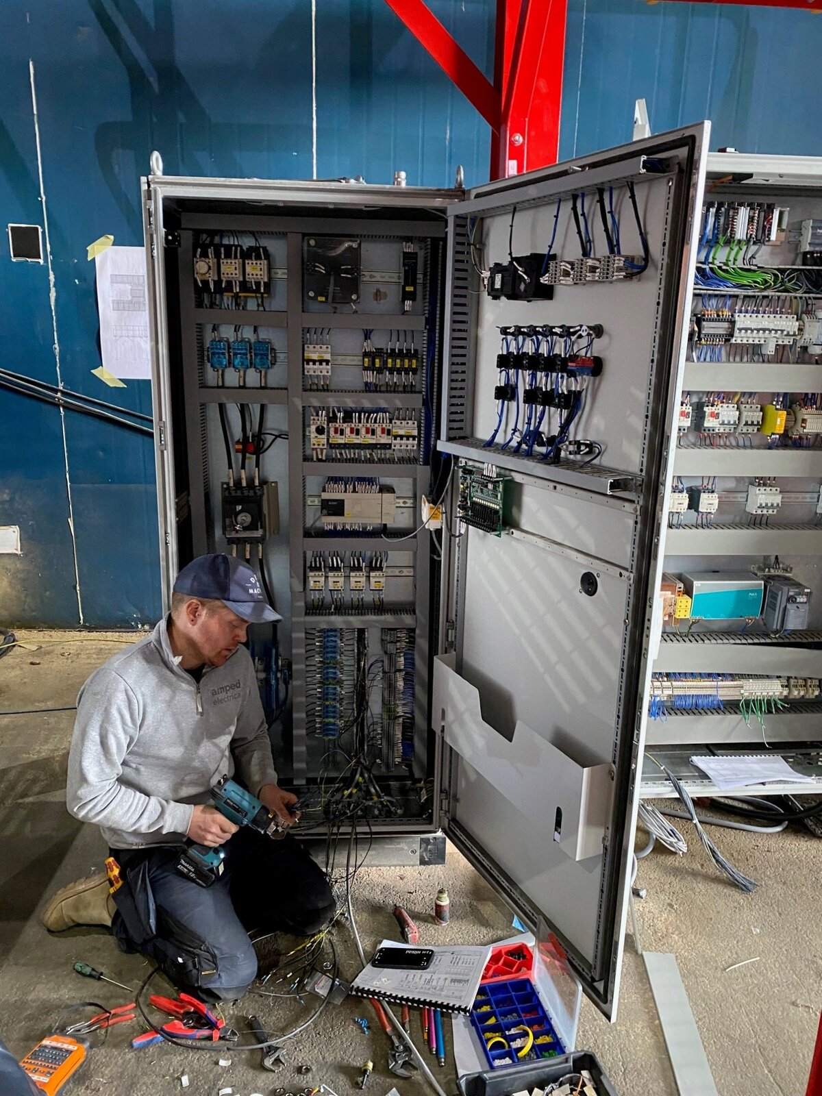 Engineer commissioning industrial control panel