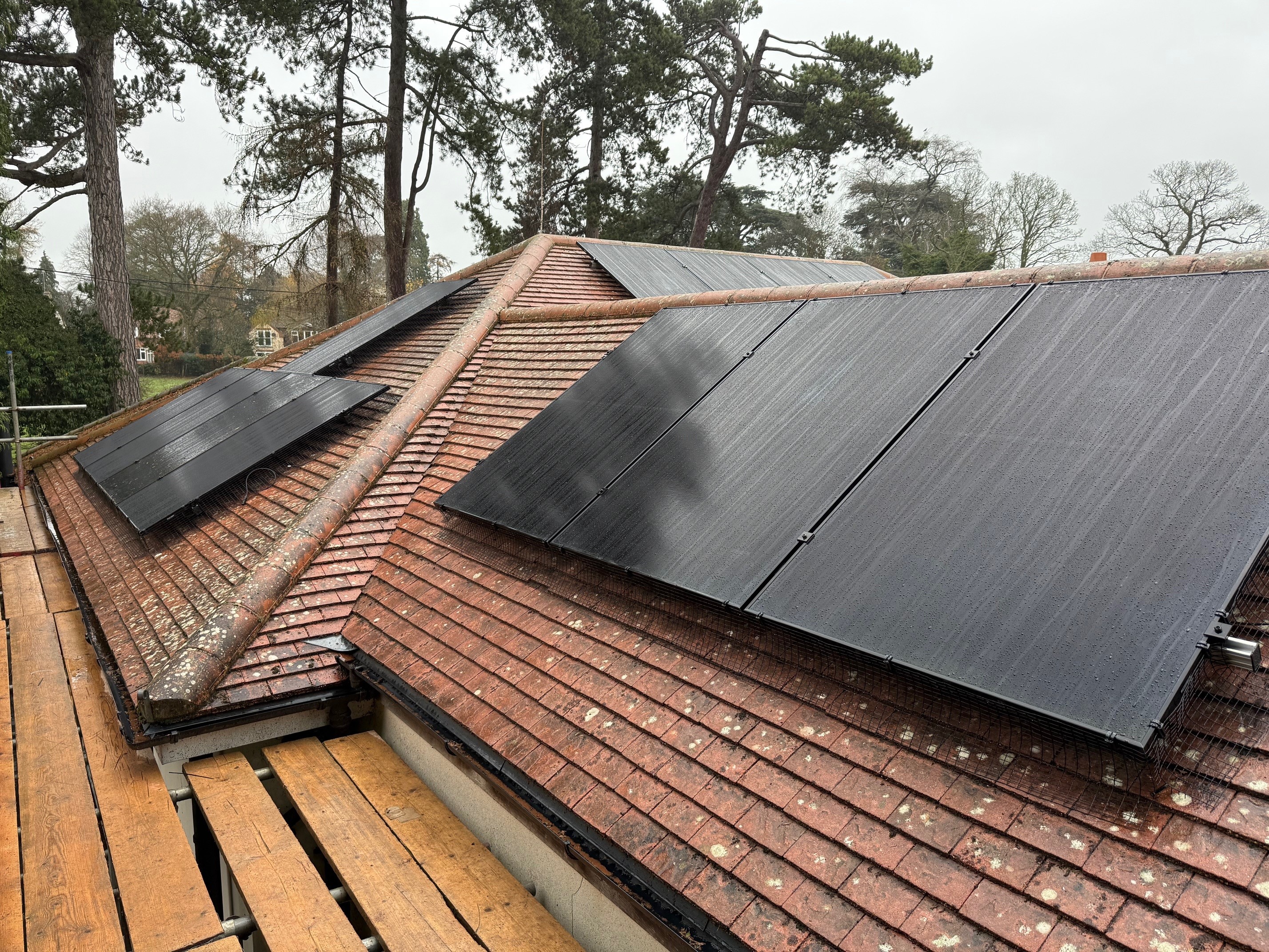 All-black solar panels installed on hip roof residential property